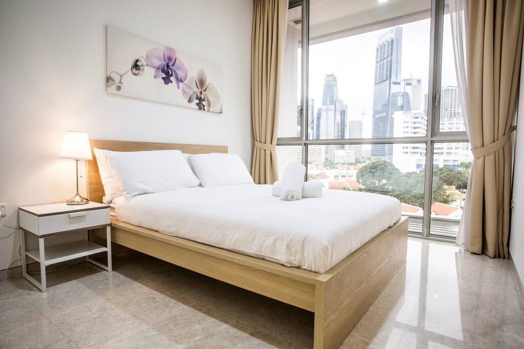 Second bedroom with queen bed and private bathroom.