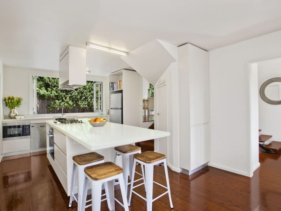 Fully equipped kitchen with fridge, dishwasher and coffee machine