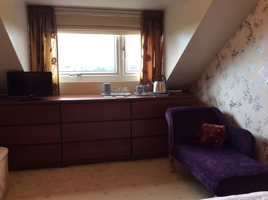 Bedroom seating area with tea and coffee making facilities