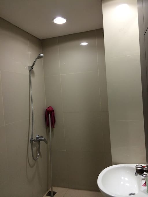 Toilet shower with hot water