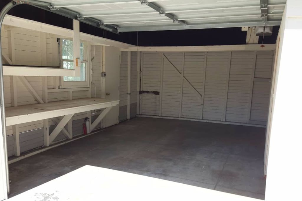 Left side of the garage: Currently being used as a parking space