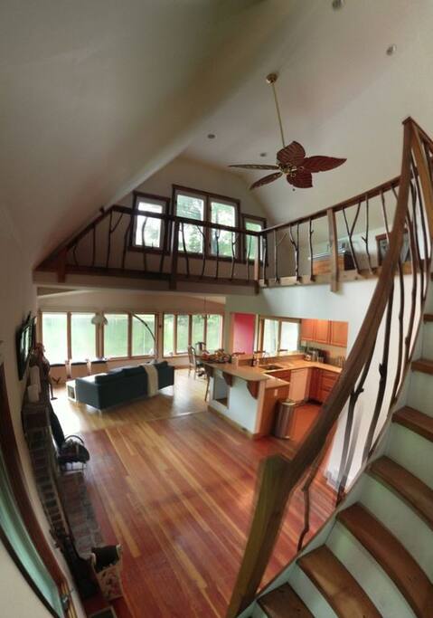 Main room & kitchen. Windows overlooking the lake.