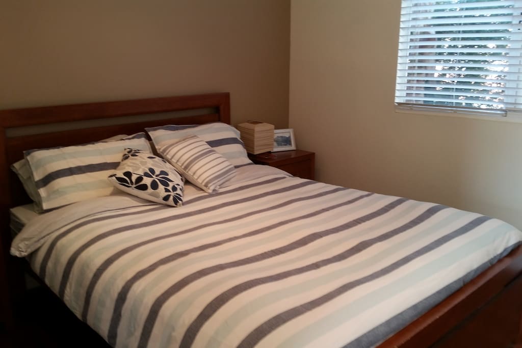 Comfy queen size bed in private room downstairs.