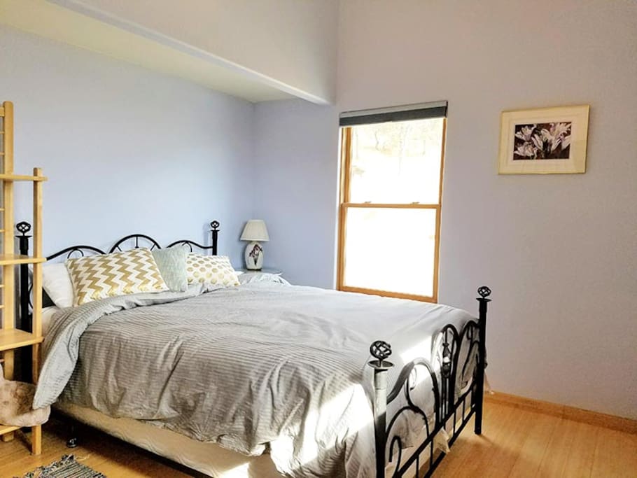 Comfy bed in lofty bedroom