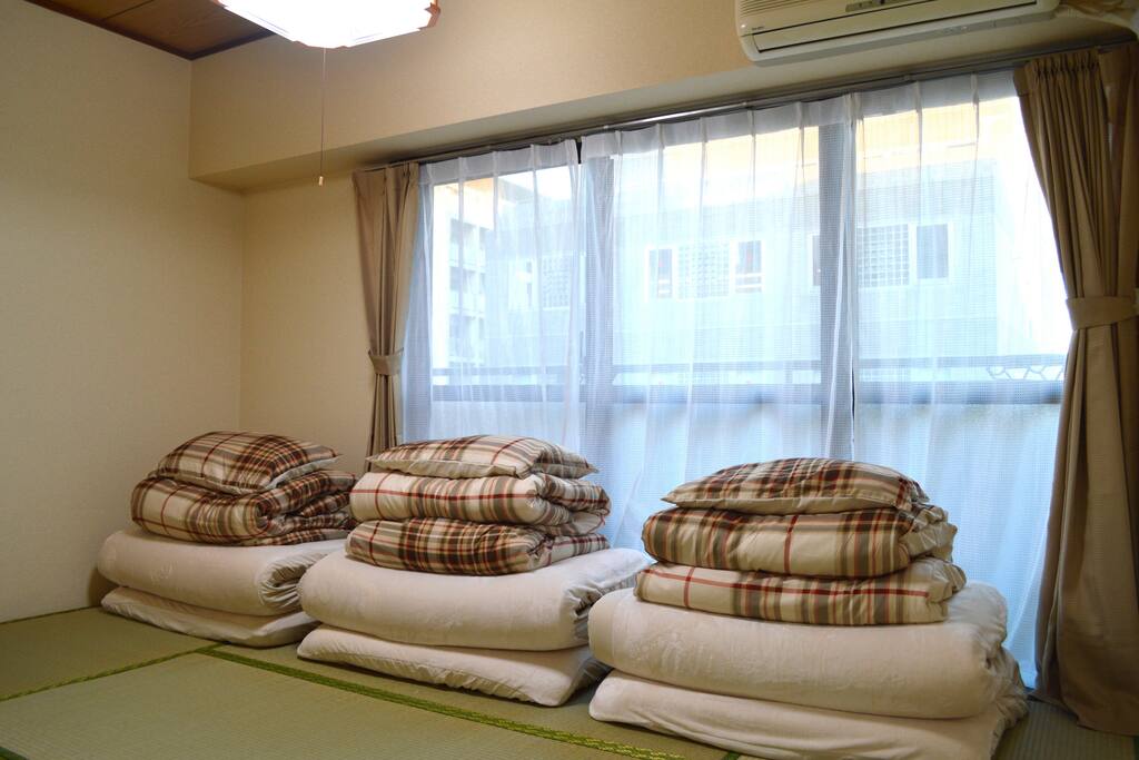 Bedroom 1. Tatami room with 3 futons. Great for kids.
