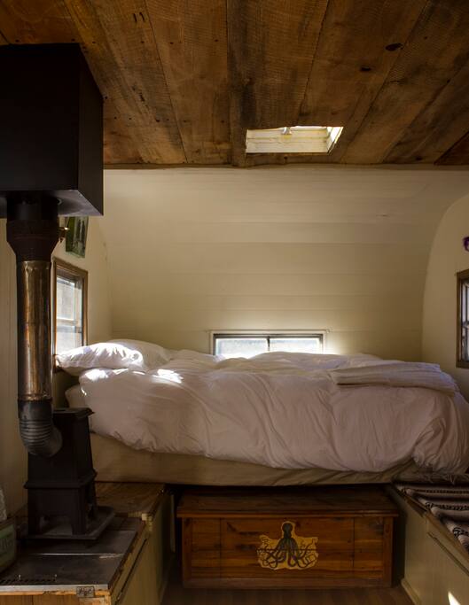 light, small and cozy with woodfired heater and sky light