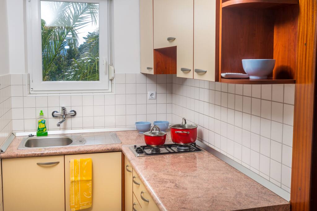 Kitchen is equipped with stove and refrigerator