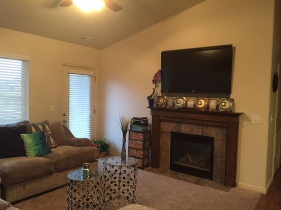 Fireplace with flat screen TV. Deck access with BBQ.