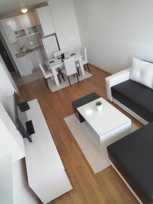 Modern living room with an open kitchen space