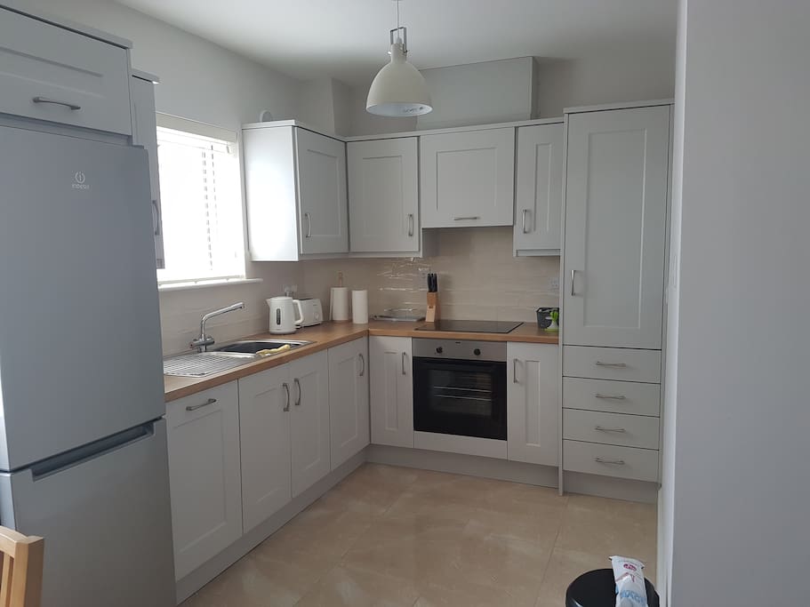 Kitchen with dish washer, fridge freezer & other appliances