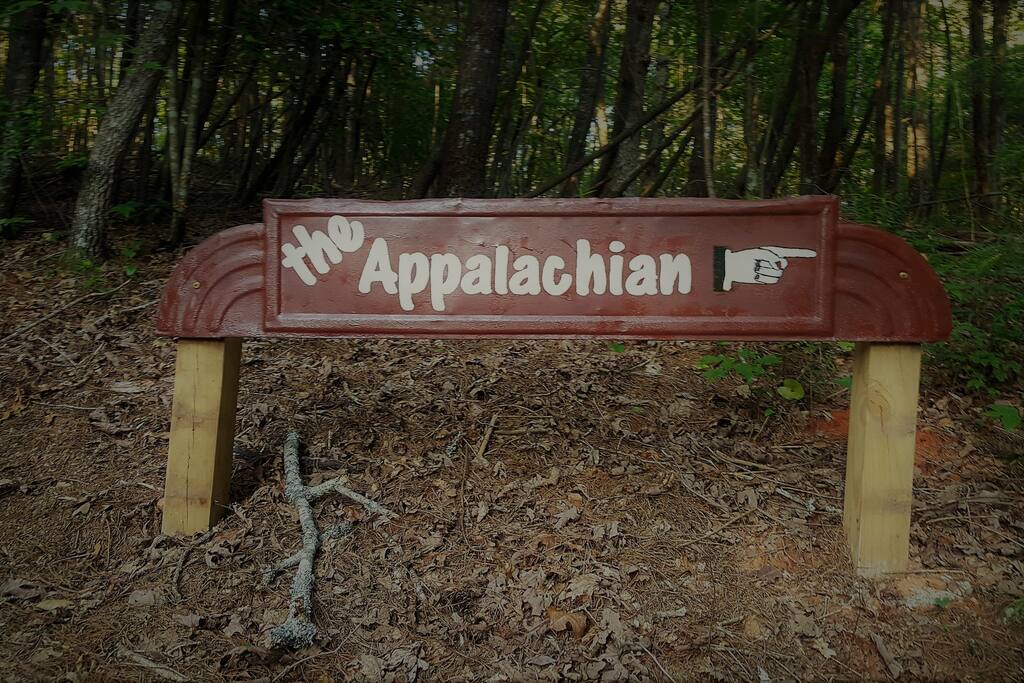 Sign approaching entrance to cabin parking.