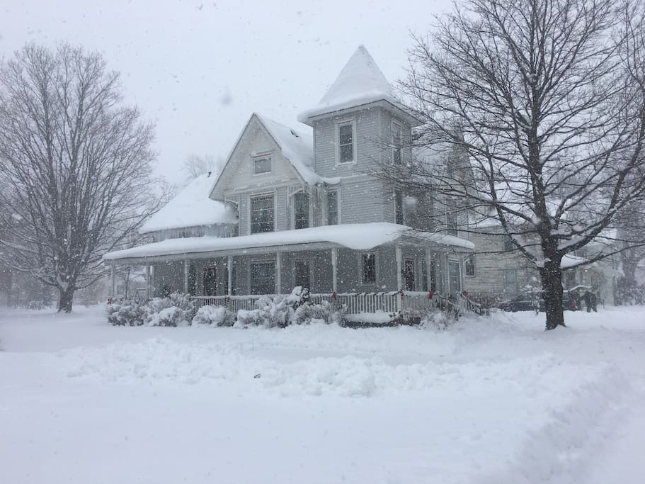 Here’s a wide shot of the wrap-around porch (now with a swing and seating area). View is from the East, in Ripley.