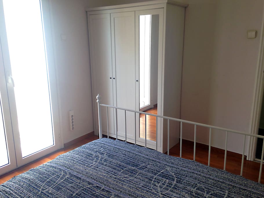 The bright side of the bedroom, and you can make it as dark as you need.
