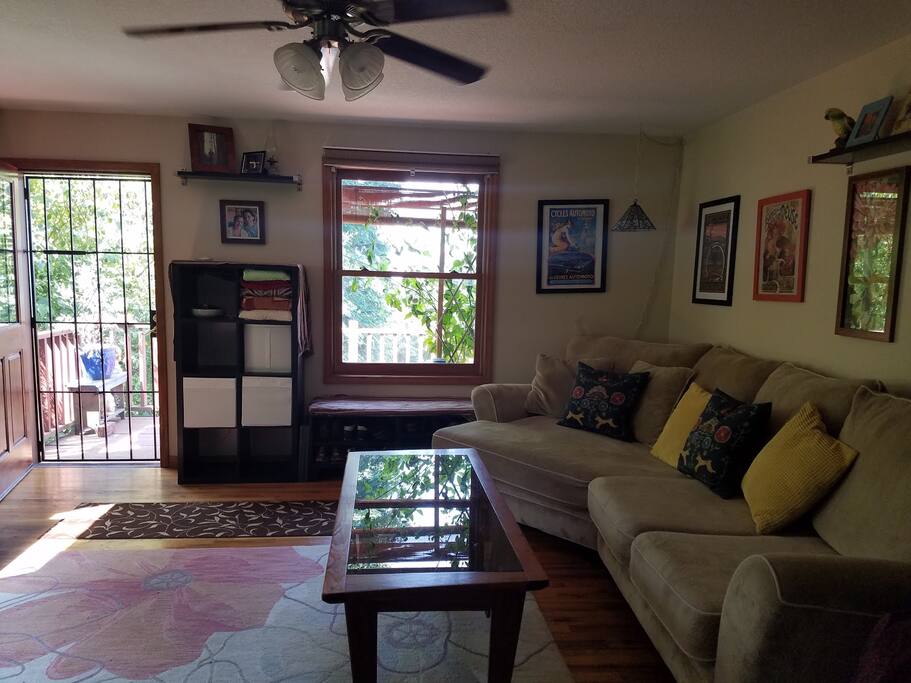 Living room with amazing snuggler couch.