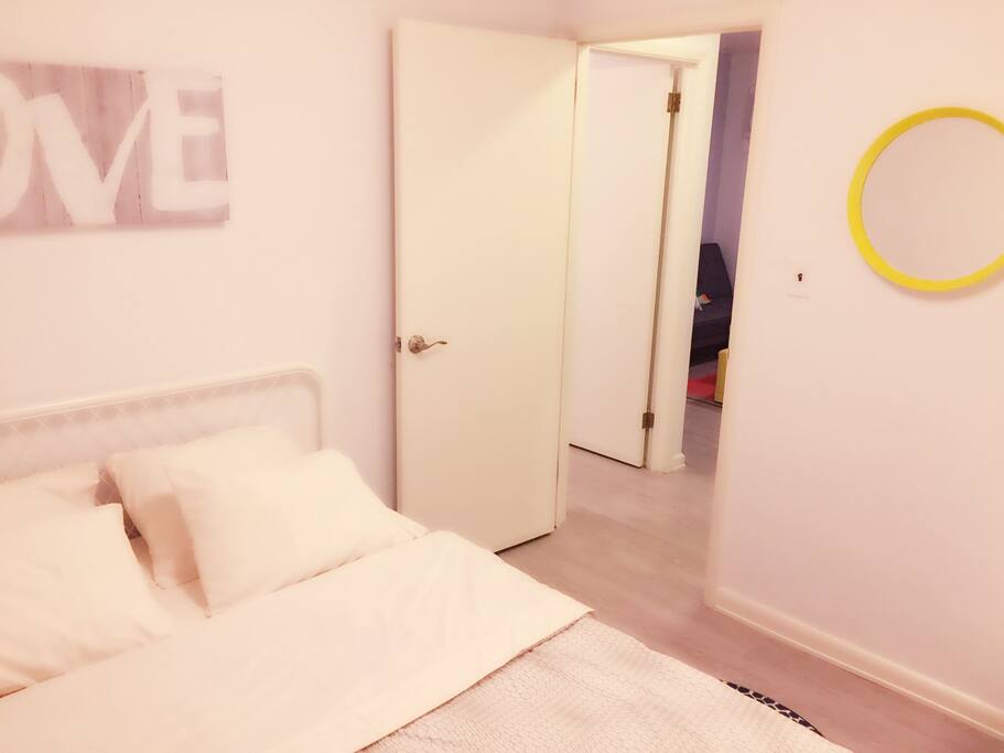 Bedroom with queen size bed and a good size of closet in the hidden corner. (Second bedroom)