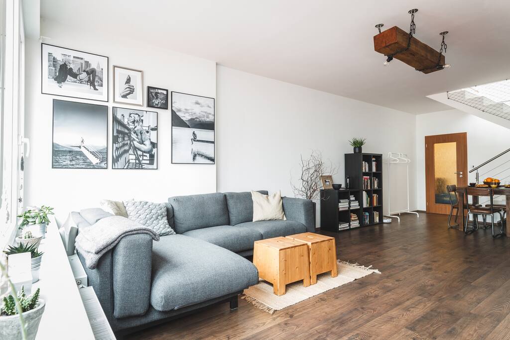 A comfortable couch with selection of original photos