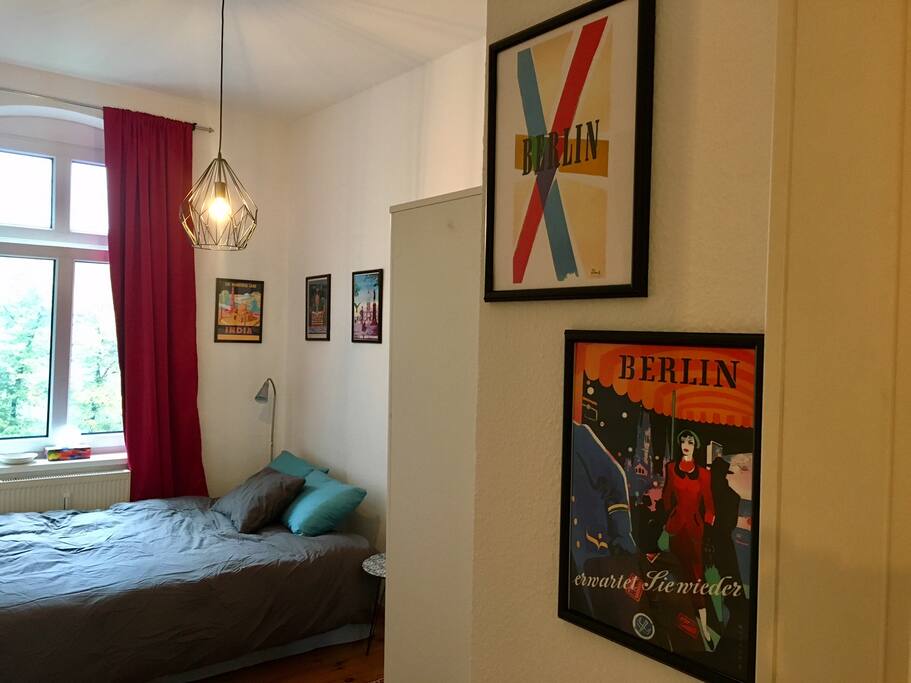 Travel posters adorn the room, starting, of course, with Berlin