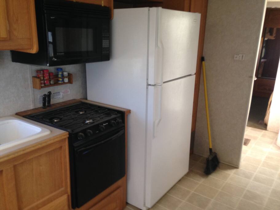 fill size refrigerator, Stove and microwave.