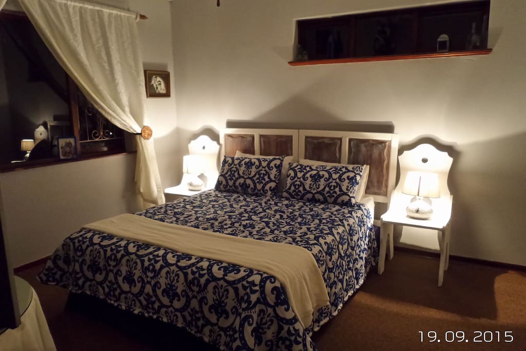 Main bedroom with en-suite bathroom and TV