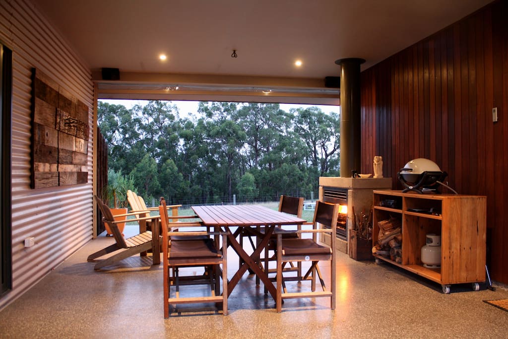 Undercover alfresco area with outdoor fireplace and BBQ.