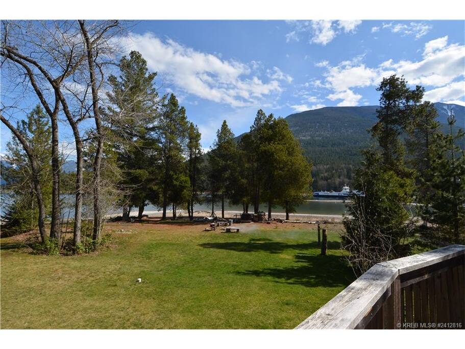 View from the deck - beach front, fire pit and Kootenay Lake ferry