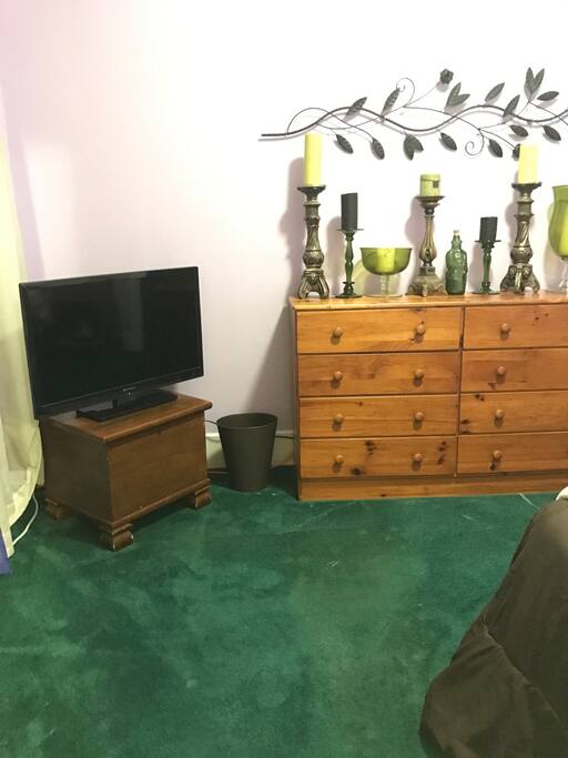 TV and dresser to store clothing.