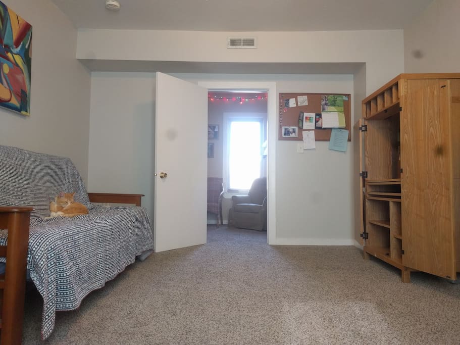 The room is spacious and comes with a large desk and high quality full size futon bed.