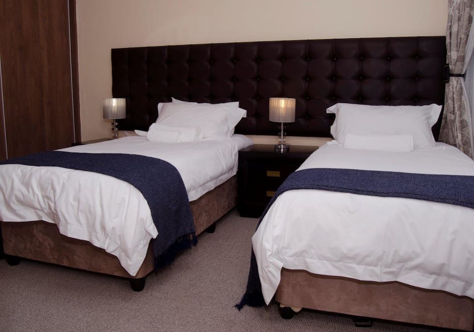 Second bedroom with two single beds which can be combined to make a King size bed