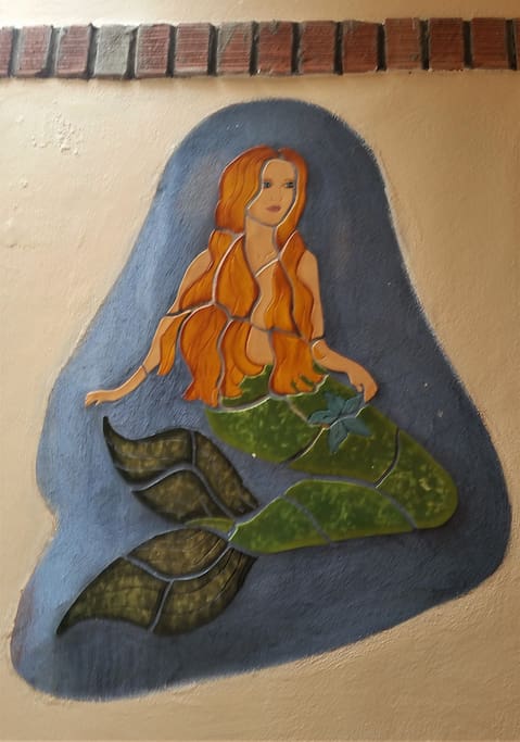 Mermaid mural in tile inside the entrance to Casa Serena