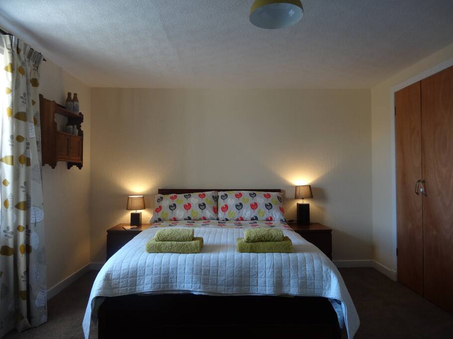 South-facing double bedroom with fitted wardrobe and dressing table