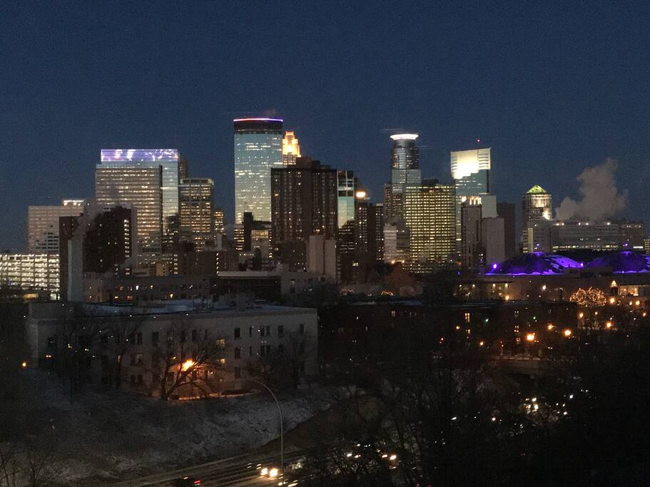 A stunning view of the Minneapolis skyline from the living space and bedroom.