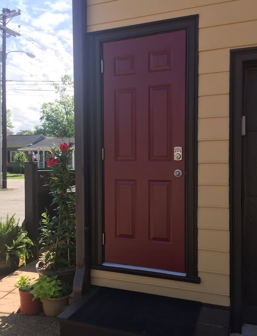 This is your entry to The Little Red Door. This is located at the back of our home. It is steps from your gravel parking space which is located at the corner of Blackburn St and Evans St.