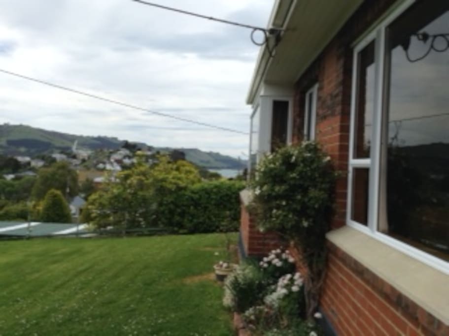 Front yard and entrance with views to the Otago Harbour.
