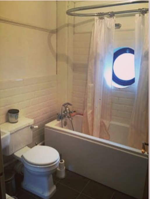 Bathroom - quirky nautical porthole window.