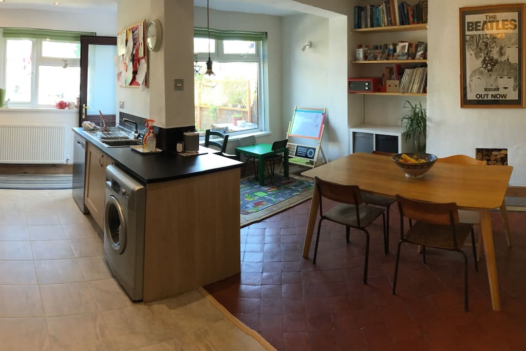 Open plan kitchen/dining room - table can seat six people. Desk space and piano - with sofa bed.