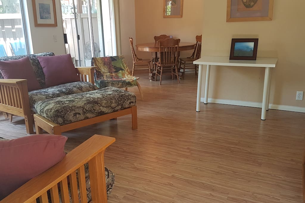 Living room with dining area and door to patio area