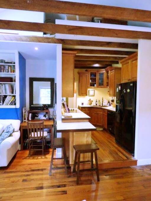 Open living area with kitchen to the side.