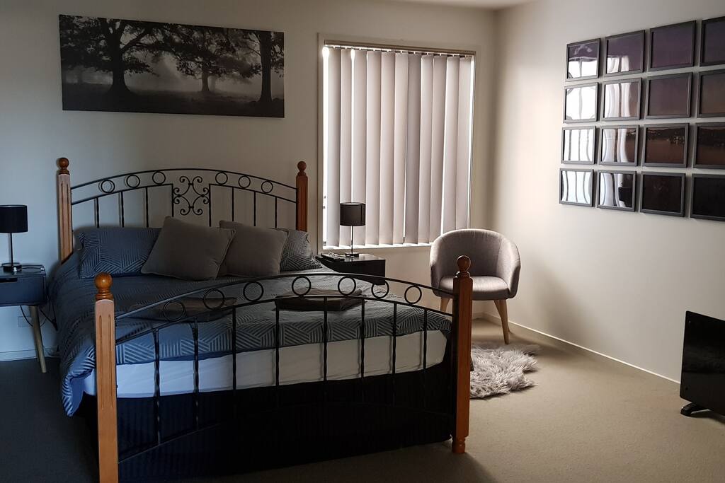 Spacious bedroom with comfy queen bed.