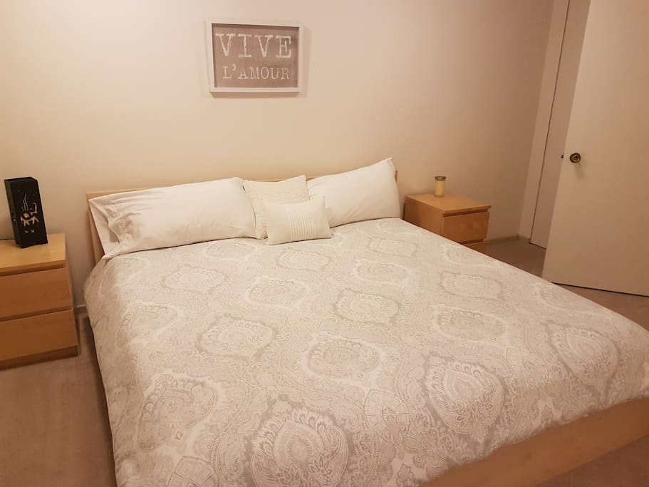 King size bed with high quality bedding.