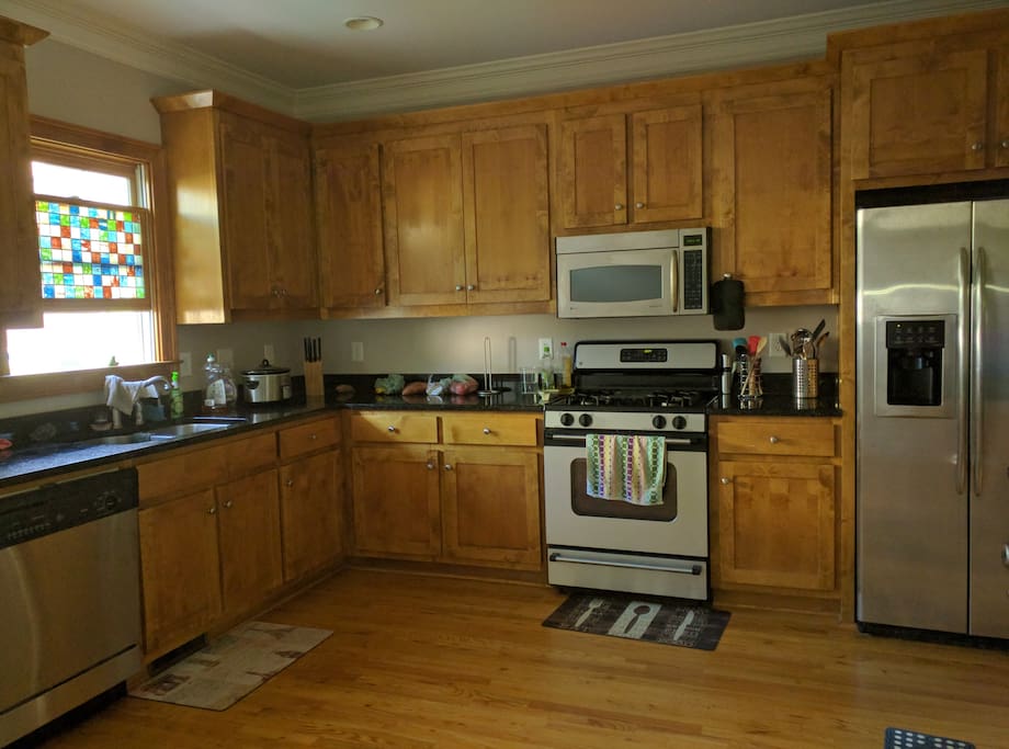 Large kitchen with gas stove.