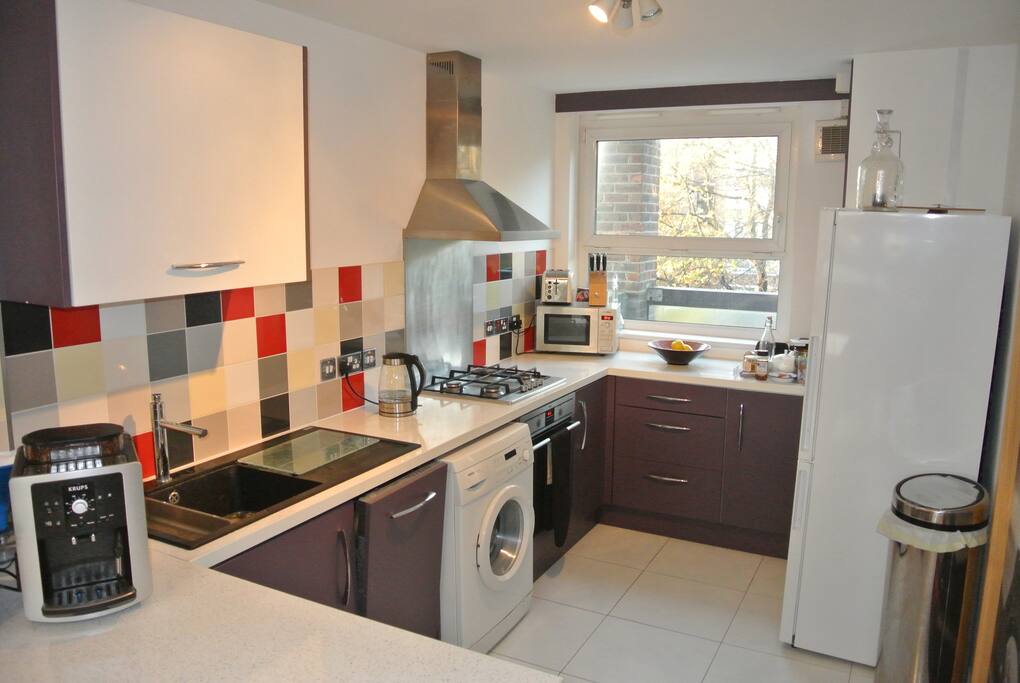 Kitchen with coffee machine and many different amenities