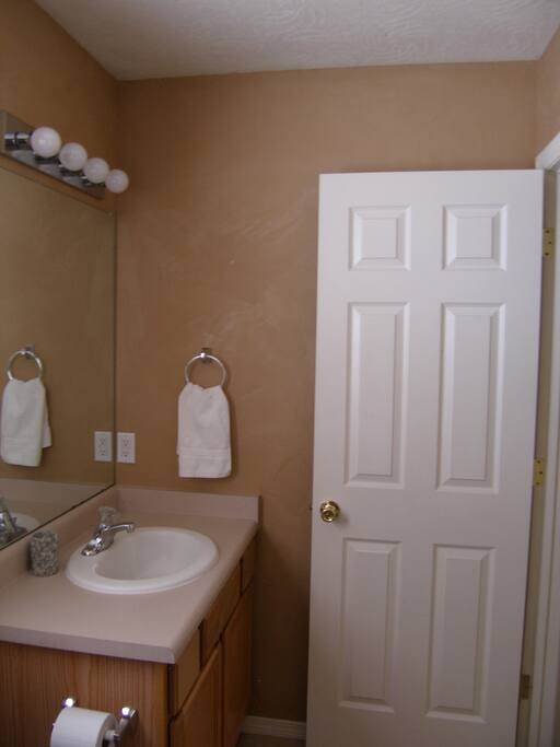 Private Bath - Find towels and supplies under the sink.
