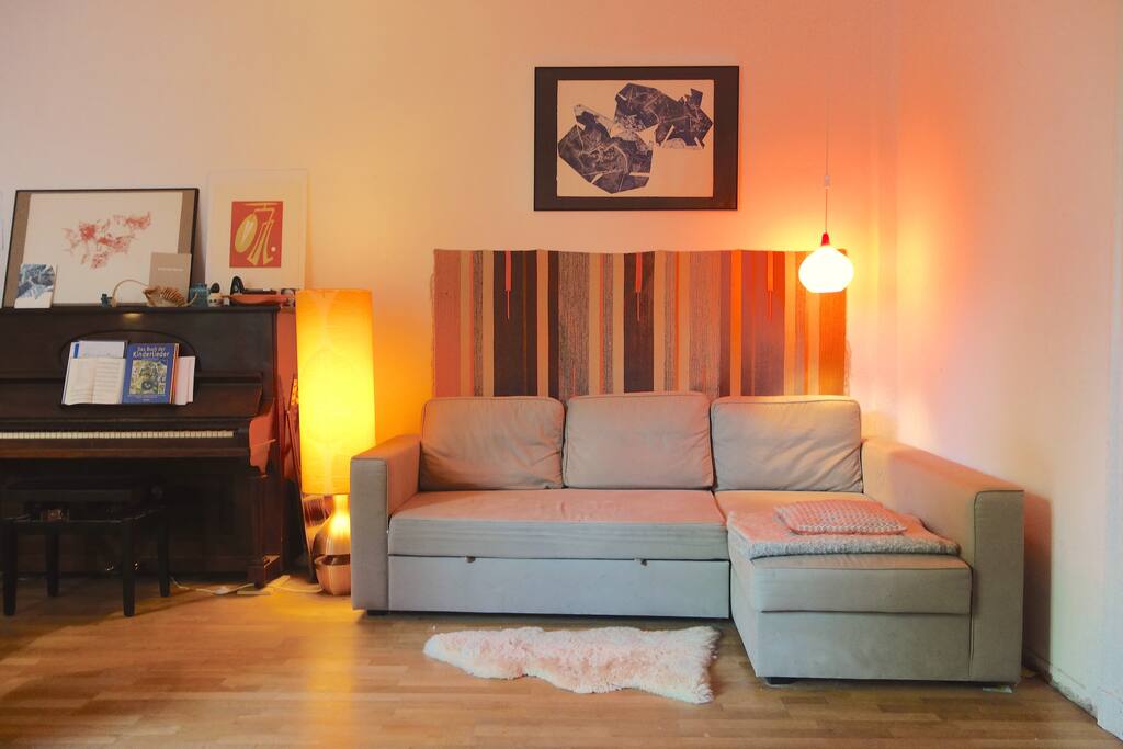 Living room and kitchen in one. The Sofa can be turned into a bed.