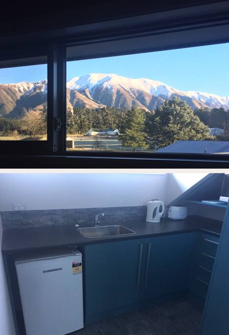 Private kitchen upstairs with view of Mt Hutt. Kitchen is complete with microwave, toaster, electric jug, mini Nespresso coffee machine, tea and coffee, refrigerator and cutlery/crockery/glassware.