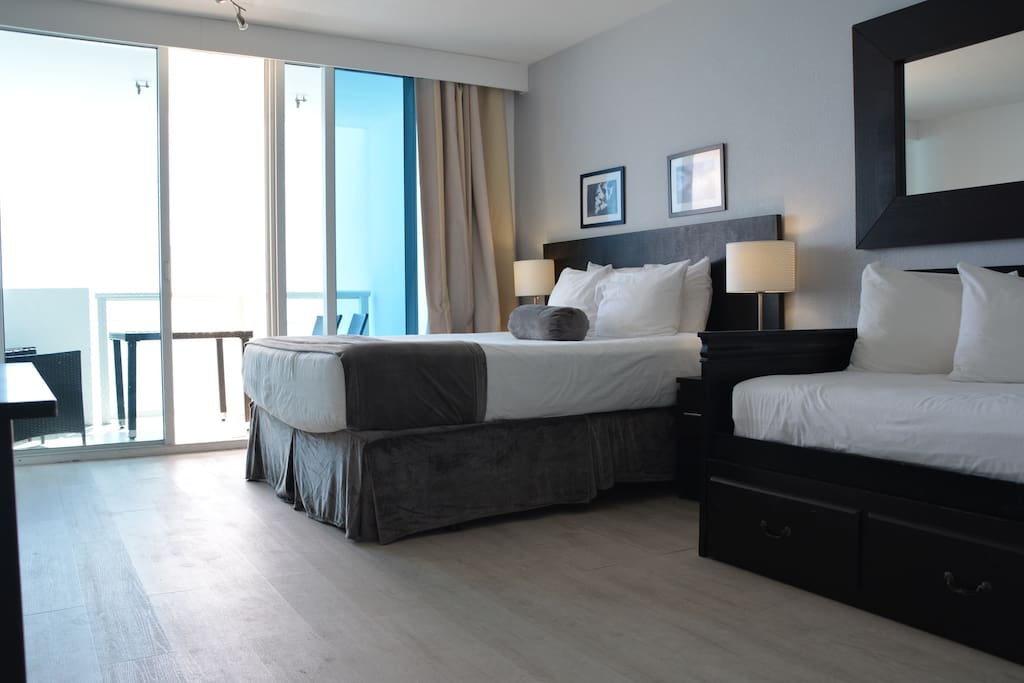 Return to this cozy room with a beautiful ocean view and step out on the balcony!