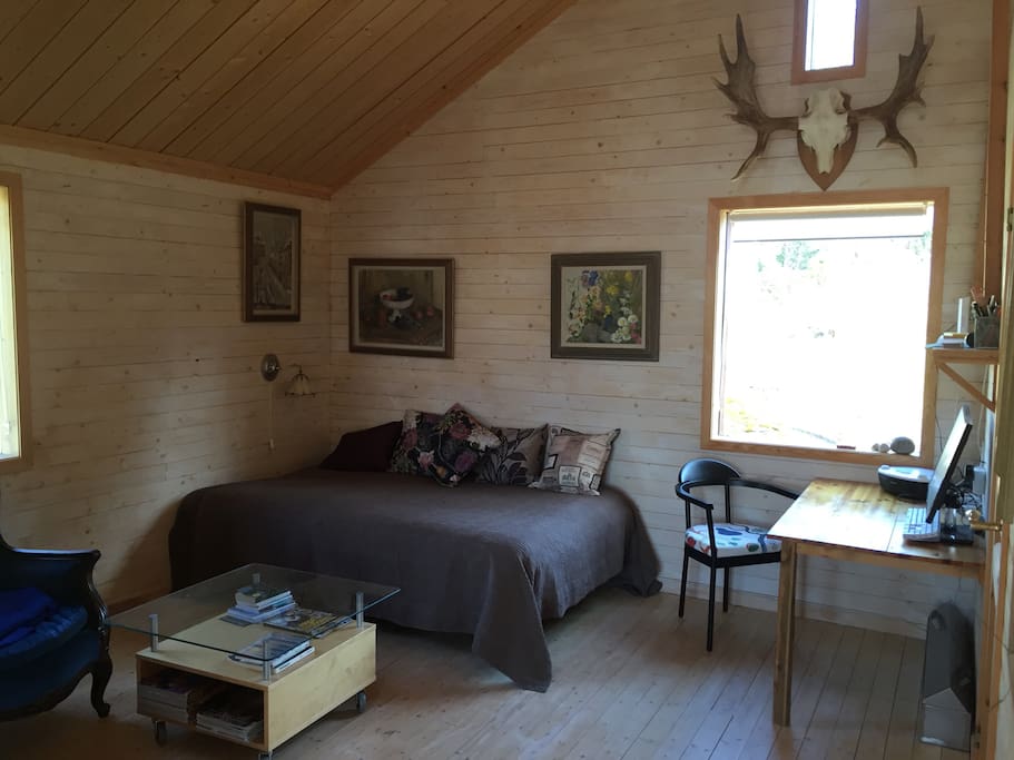 A living-room with double bed.