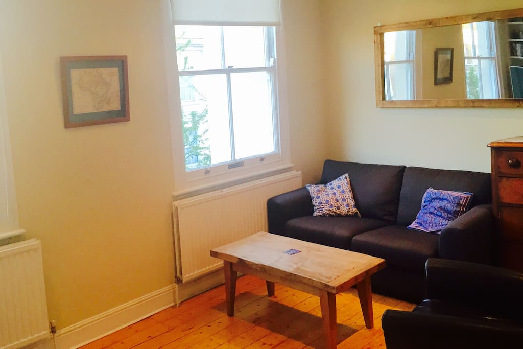 Sofa section of lounge, including large comfortable leather armchair
