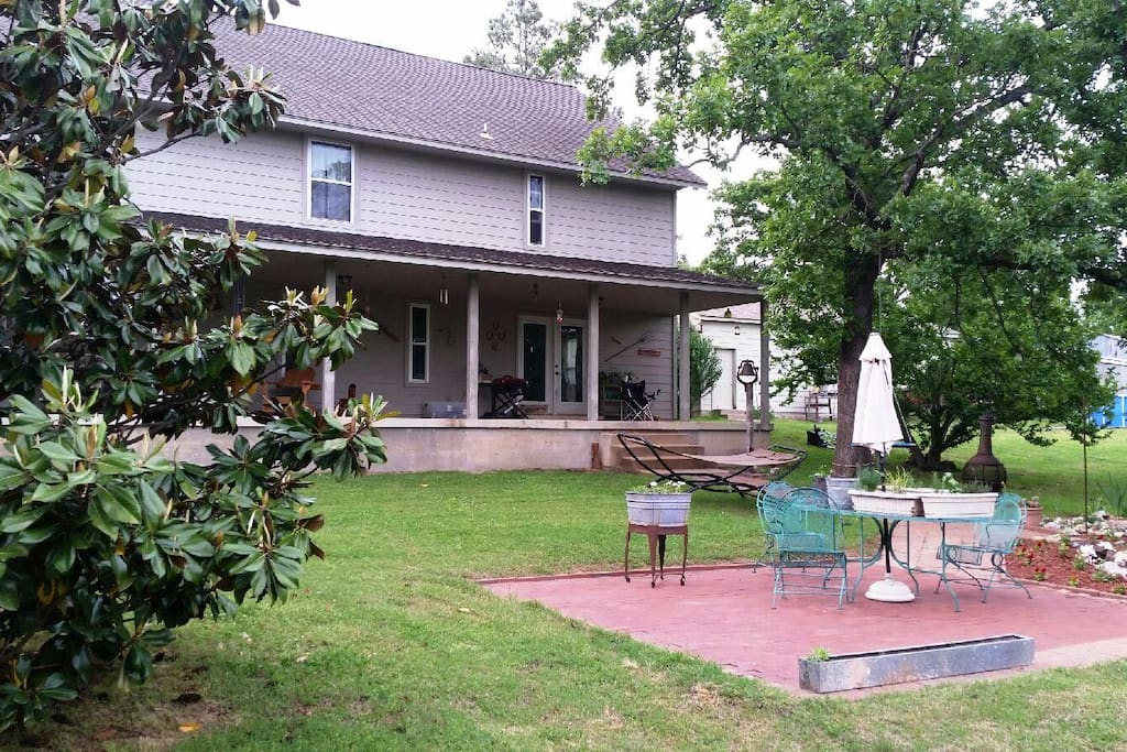 Beautiful backyard with porch that overlooks the woods. You may just spot a white tailed deer or 2.