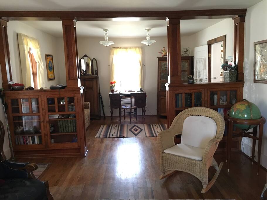 Custom bookshelves serve as room divider between the living and dining rooms.