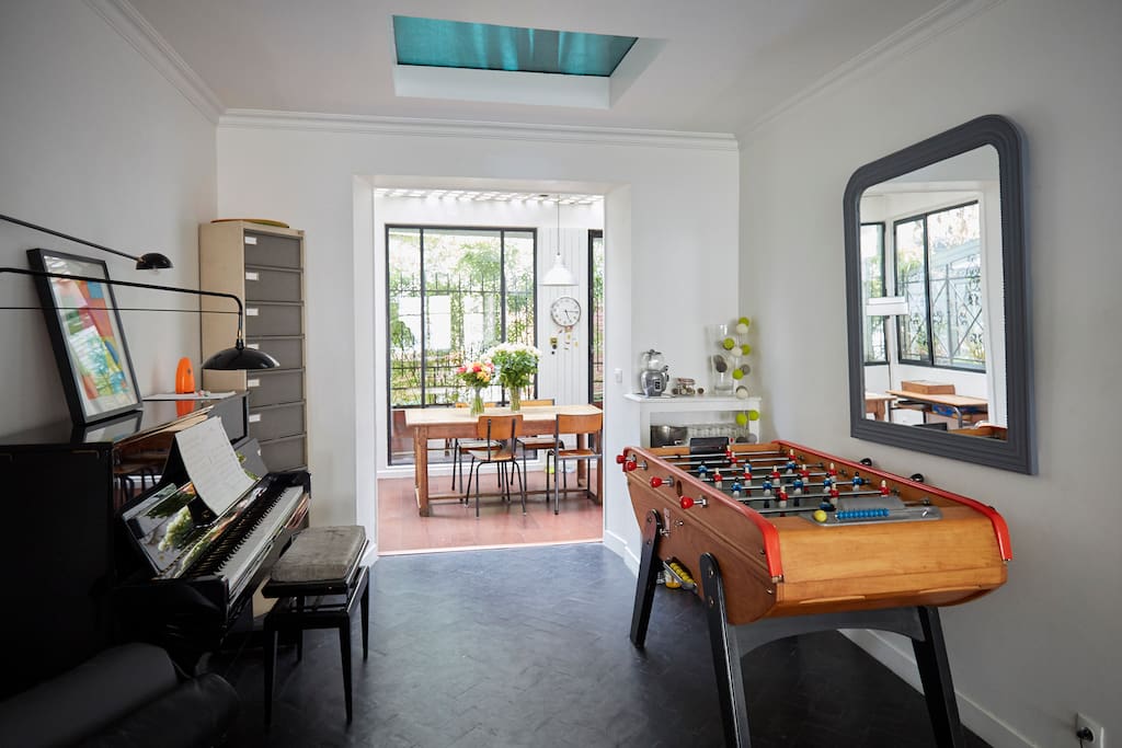 Ground floor: the living room (with a foosball) and view of the kitchen